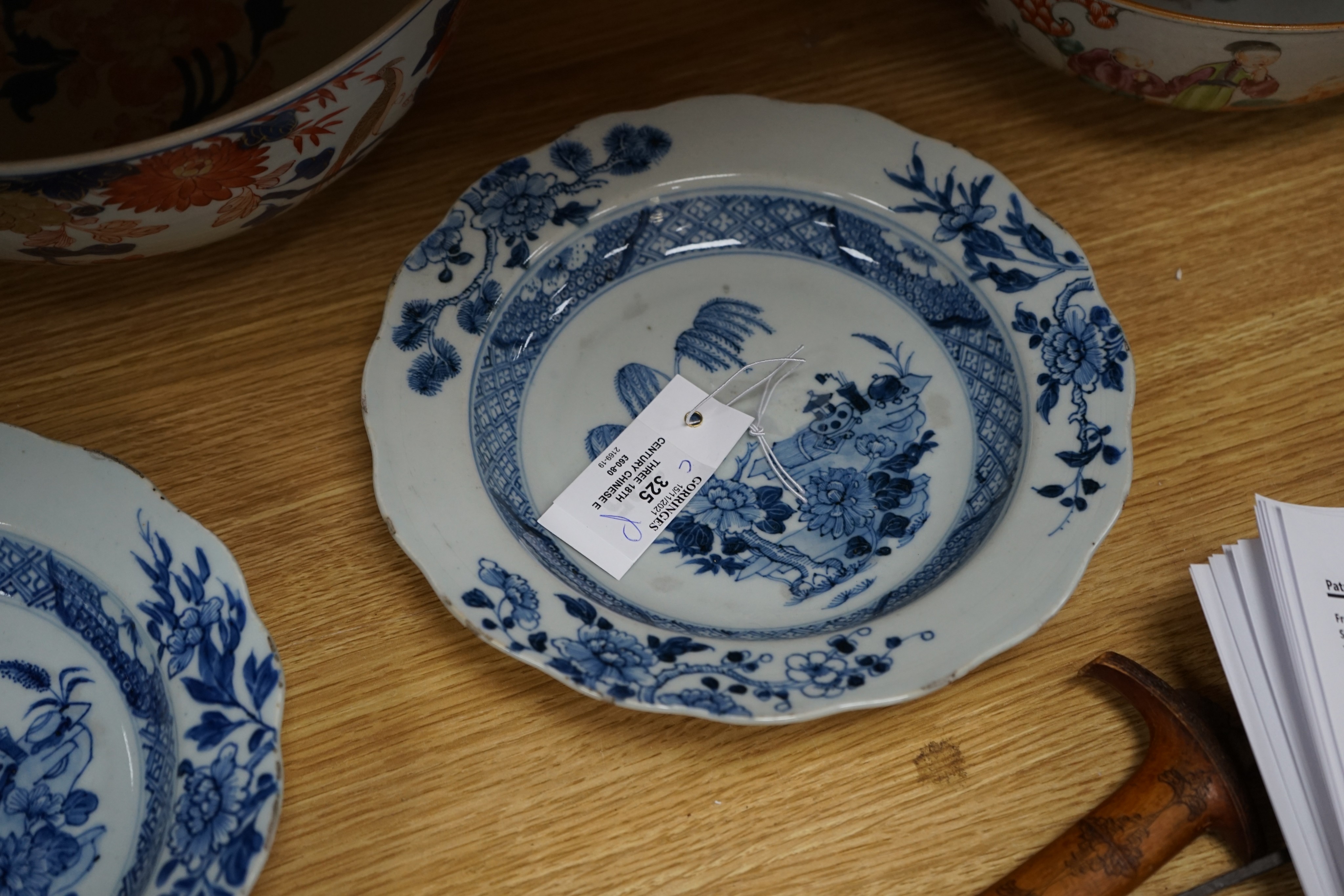 Three 18th century Chinese export porcelain bowls, largest 28 cm and two plates